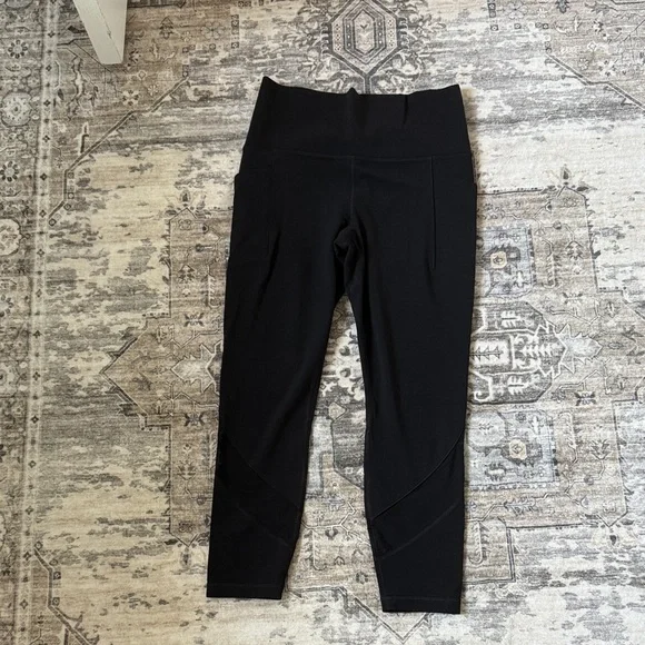 Athleta Black salutation stash pocket mesh panel. 7/8 Leggings - Picture 1 of 6